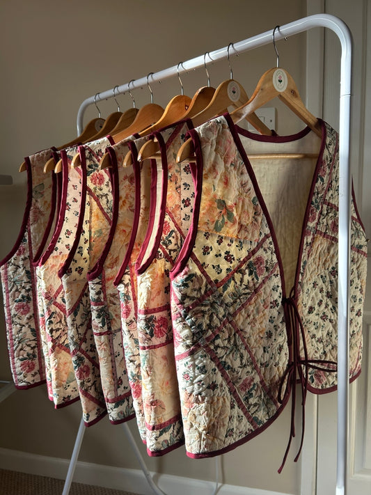 Burgundy floral gilet.